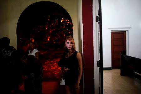 Trans Andy Cuadrado, 21, stands at the door of a chapel after a mass in Matanzas, Cuba, May 5, 2017. Picture taken on May 5, 2017. REUTERS/Alexandre Meneghini