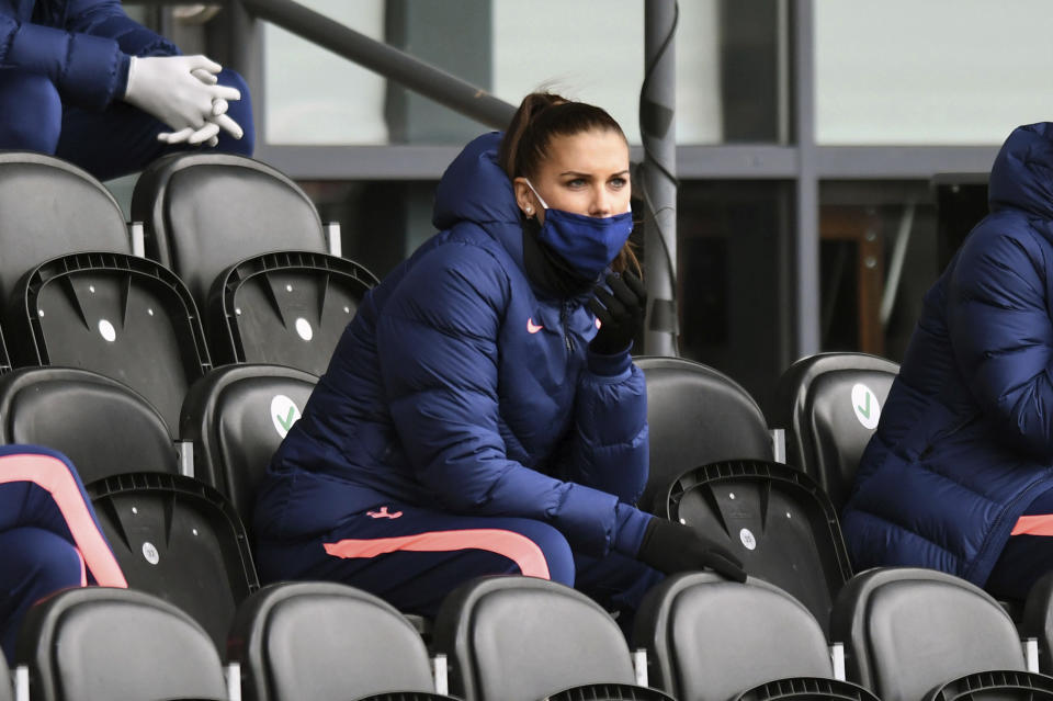 Tottenham Hotspur's Alex Morgan sit in the stands during the FA Women's Super League soccer match between Tottenham Hotspur and Manchester United, at the Hive, in London, Saturday, Oct. 10, 2020. (Kirsty O'Connor/PA via AP)