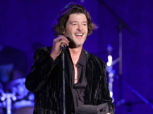 <p>Rich Polk/Getty</p> Robin Thicke performs onstage during the 25th anniversary of UCLA Jonsson Cancer Center Foundation's "Taste for a Cure" event on April 29, 2022 in Los Angeles, California.