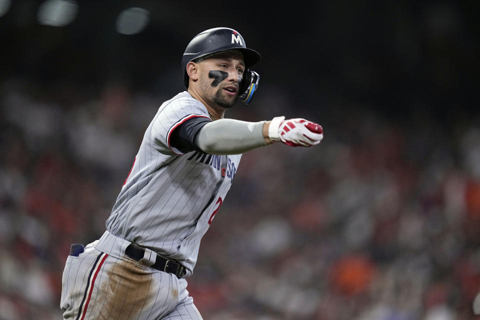 Minnesota Twins designated hitter Royce Lewis signals after his solo home run during the seventh inning in Game 1 of an American League Division Series baseball game against the Houston Astros, Saturday, Oct. 7, 2023, in Houston. (AP Photo/Kevin M. Cox)