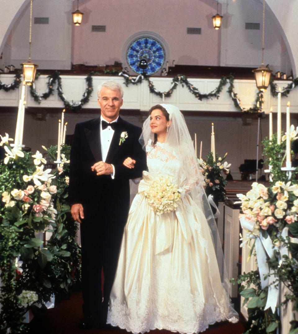 Steve Martin walking down the aisle with Kimberly Williams-Paisley in a scene from the film 'Father Of The Bride', 1991. (Photo by Touchstone/Getty Images)