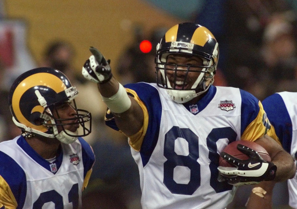 While Torry Holt stands outside the Hall, some are ready to enshrine Julian Edelman. (AP Photo/Chuck Burton)