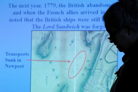 Dr. Kathy Abbass, executive director of the Rhode Island Marine Archeology Project, speaks in Providence, Rhode Island in front of a map of Newport Harbor as she announces that her organization believes it has found the wreck of Captain James Cook's ship the Endeavour, May 4, 2016. REUTERS/Brian Snyder