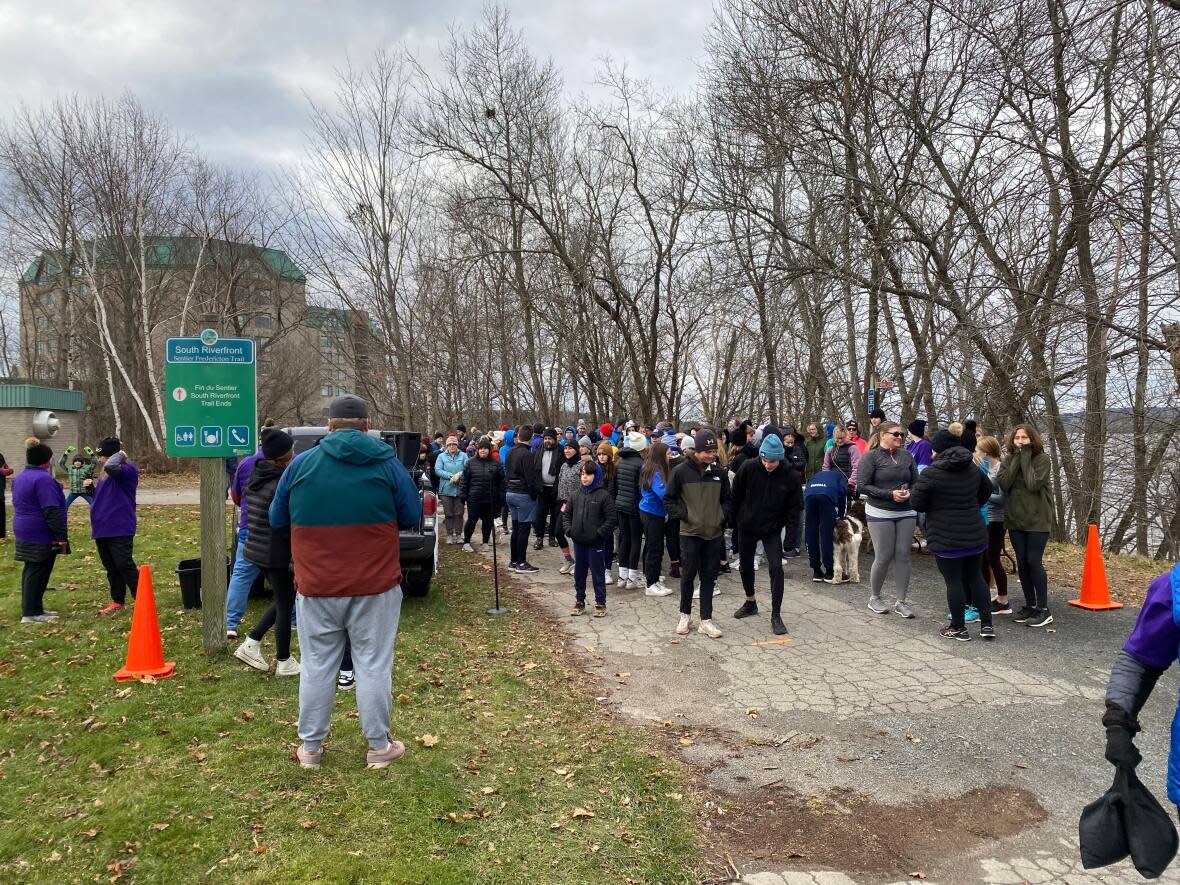 Dozens gathered in Fredericton for a five-kilometer event to honour Lexi Daken.  (ANIEKAN ETUHUBE/CBC News - image credit)