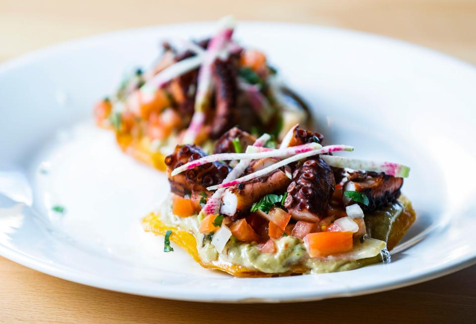 Octopus tostadas with a fried corn tortilla topped with octopus ceviche and house made guacamole from Happy Belly Waterside is served at the Goodbounce Pickleball Yard on River Shore Drive off River Road in Louisville. April 17, 2023