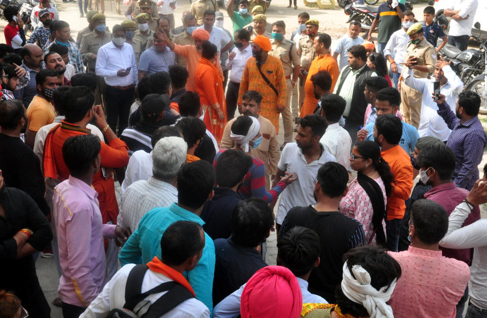 Supporters of a Hindu organization demonstrated at the Dasna Devi temple where a few days ago, a minor was thrashed for drinking water, at Dasna on March 19, 2021 in Ghaziabad, India. The Devi temple of Dasna, Ghaziabad had come under limelight after a teenage Muslim boy named Asif claimed that he was beaten for trying to drink some water inside the temple premises. The Head Priest (Mahant) Yati Narsinghanand claimed that the temple management was forced to bar Muslims entry into the temple premises after incidents of theft, assault and sexual harassment of female devotees. Dhaulana MLA Aslam Chaudhary has called for removal of board, this led Hindu organizations to come in support saying they will not let the board be removed. (Photo by Sakib Ali/Hindustan Times via Getty Images)