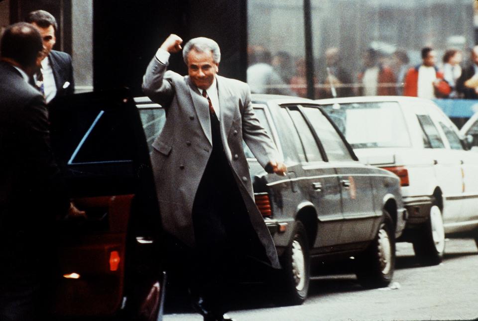 John Gotti celebrates after being found not guilty in a court case.