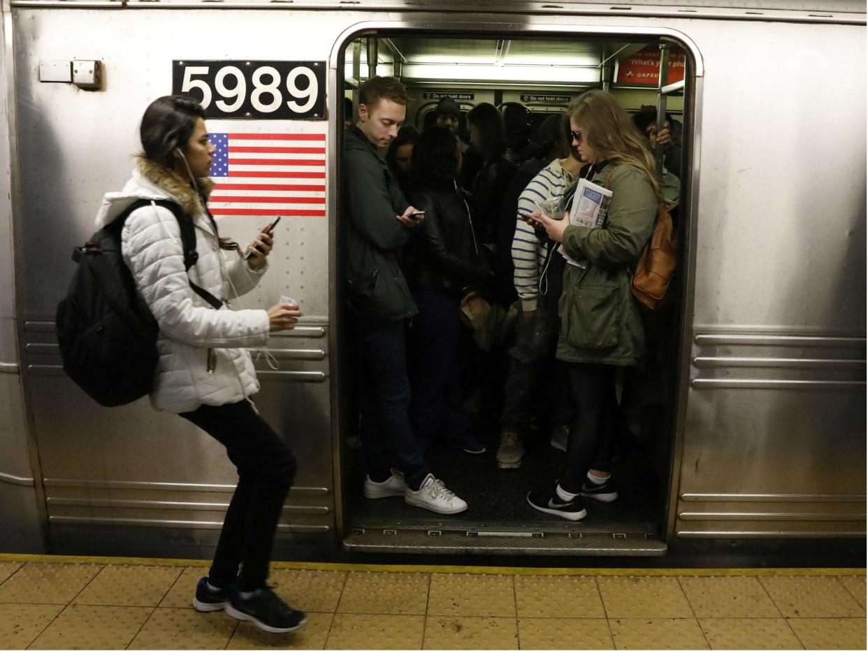 Passengers wait inside a subway train in New York City on April 21, 2017: REUTERS/Brendan Mcdermid