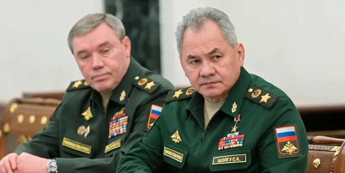 Russian Defense Minister Sergei Shoigu, right, and Head of the General Staff of the Armed Forces of Russia and First Deputy Defense Minister Valery Gerasimov listen to Russian President Vladimir Putin during their meeting in Moscow, Russia, on Feb. 27, 2022.