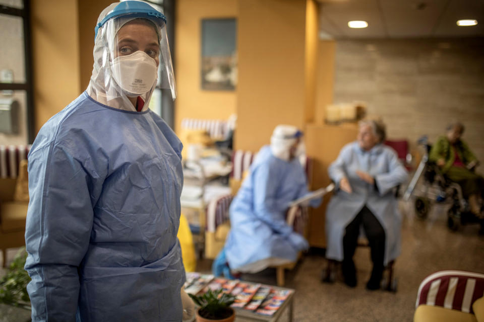 Aid workers from the Spanish NGO Open Arms carry out coronavirus detection tests on the elderly at a nursing home in Barcelona, Spain on April 1, 2020. (Santi Palacios/AP)