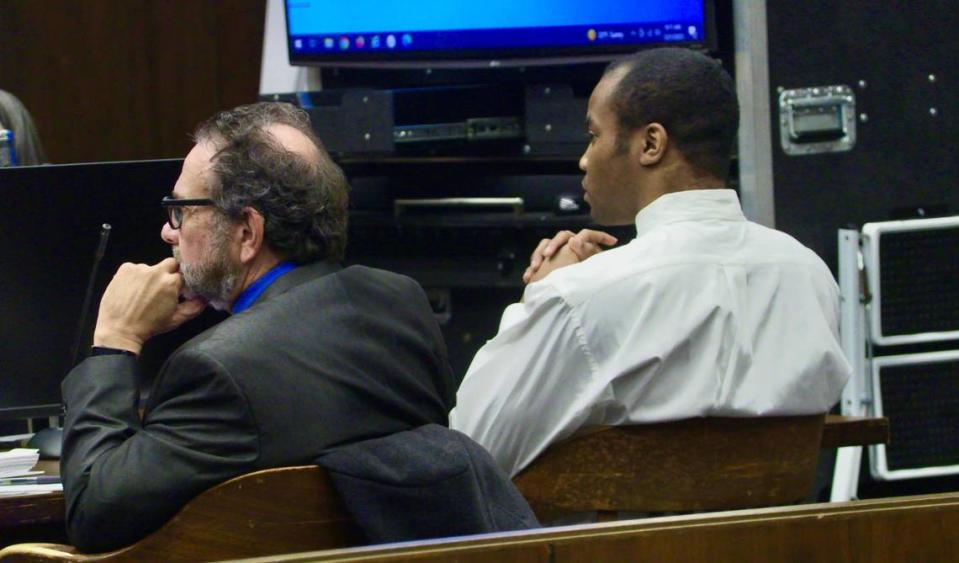 Jayvon Hatchett, right, sits with his public defender, Steve Craft.