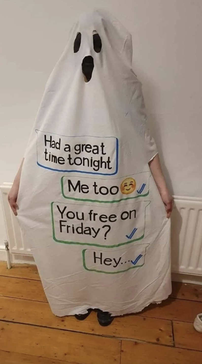 A ghost costume with "Had a great time tonight," "Me too," "You free on Friday?" and "Hey" bubbles written on it