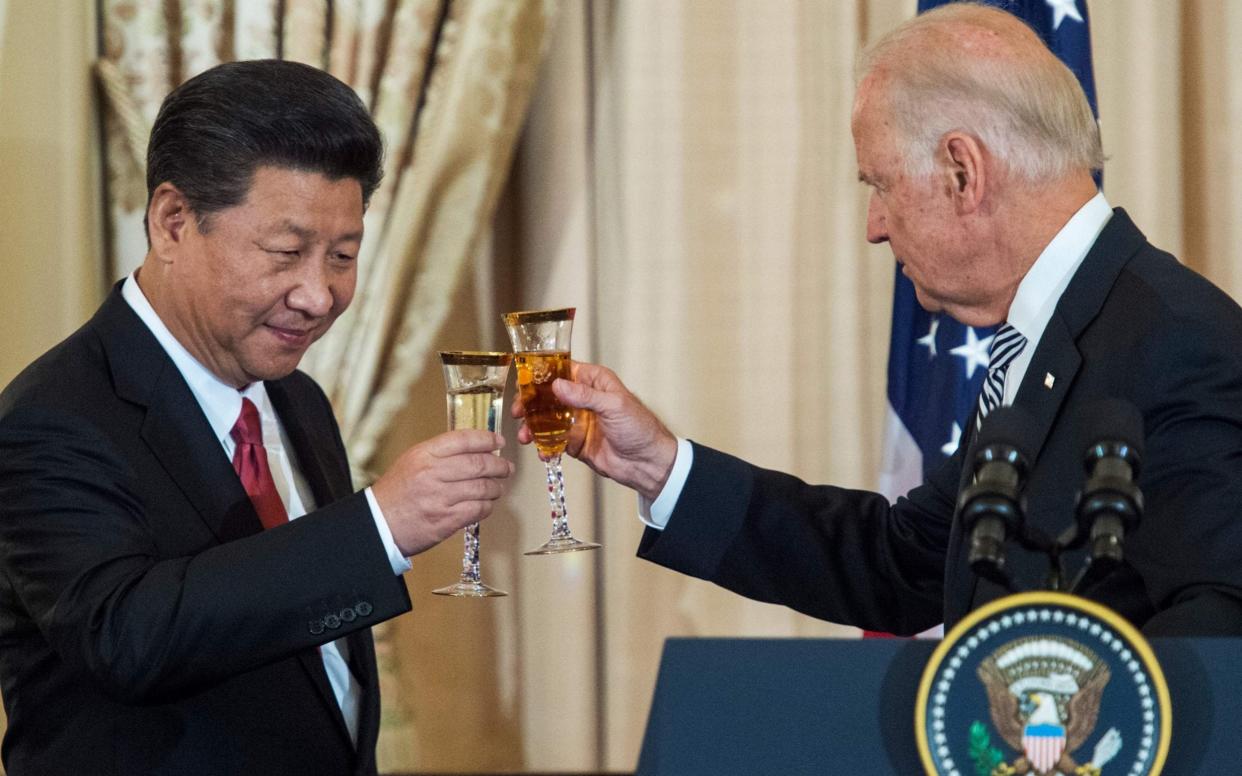 Then US Vice President Joe Biden and Chinese President Xi Jinping toast during a State Luncheon for China at the Department of State in Washington, DC in 2015 - AFP