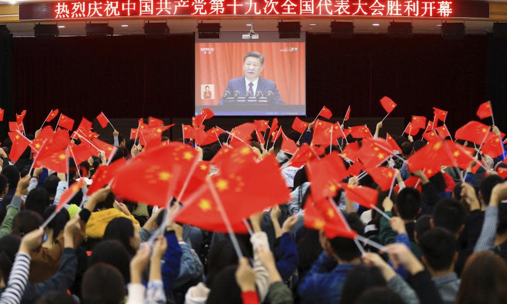 Students watch Xi’s speech at the 2017 Chinese Communist party congress.