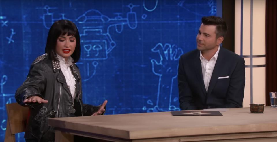 Demi Lovato shows Mark Rober how tall her amethyst crystals are in an appearance on "Jimmy Kimmel Live"