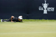 Xander Schauffele reads the lie on the 18th green during the first round of the U.S. Open Golf Championship, Thursday, June 17, 2021, at Torrey Pines Golf Course in San Diego. (AP Photo/Marcio Jose Sanchez)