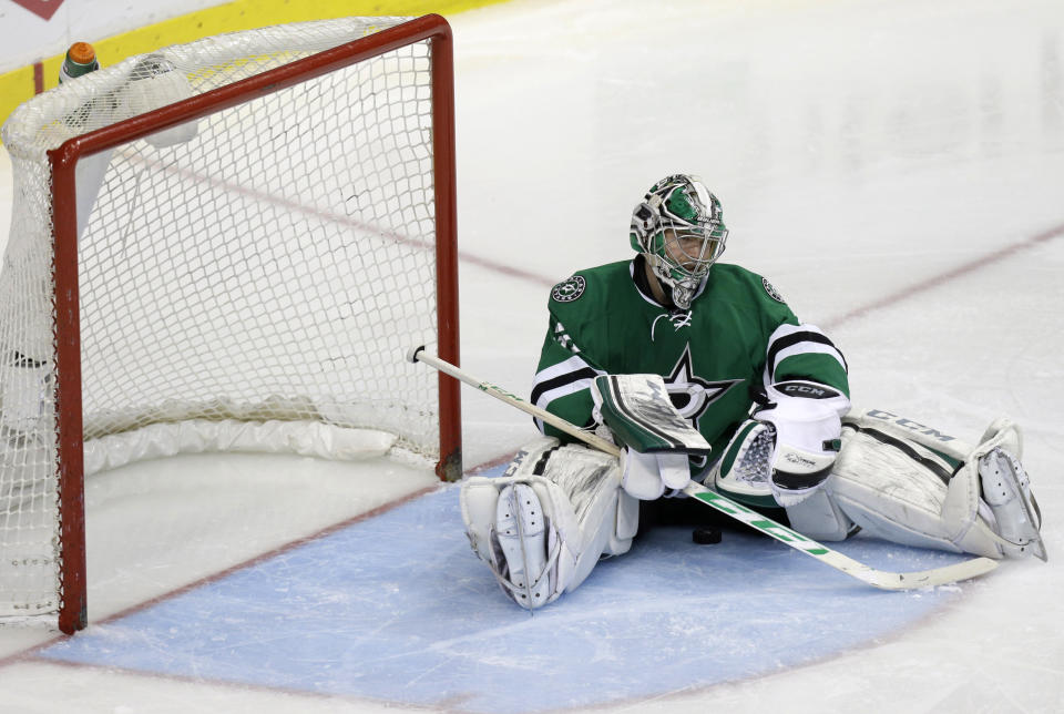 Dallas Stars goalie Kari Lehtonen (32) sits after Anaheim Ducks Nick Bonino scored the game winning overtime goal of Game 6 to win the first-round NHL hockey playoff series in Dallas, Sunday, April 27, 2014. (AP Photo/LM Otero)