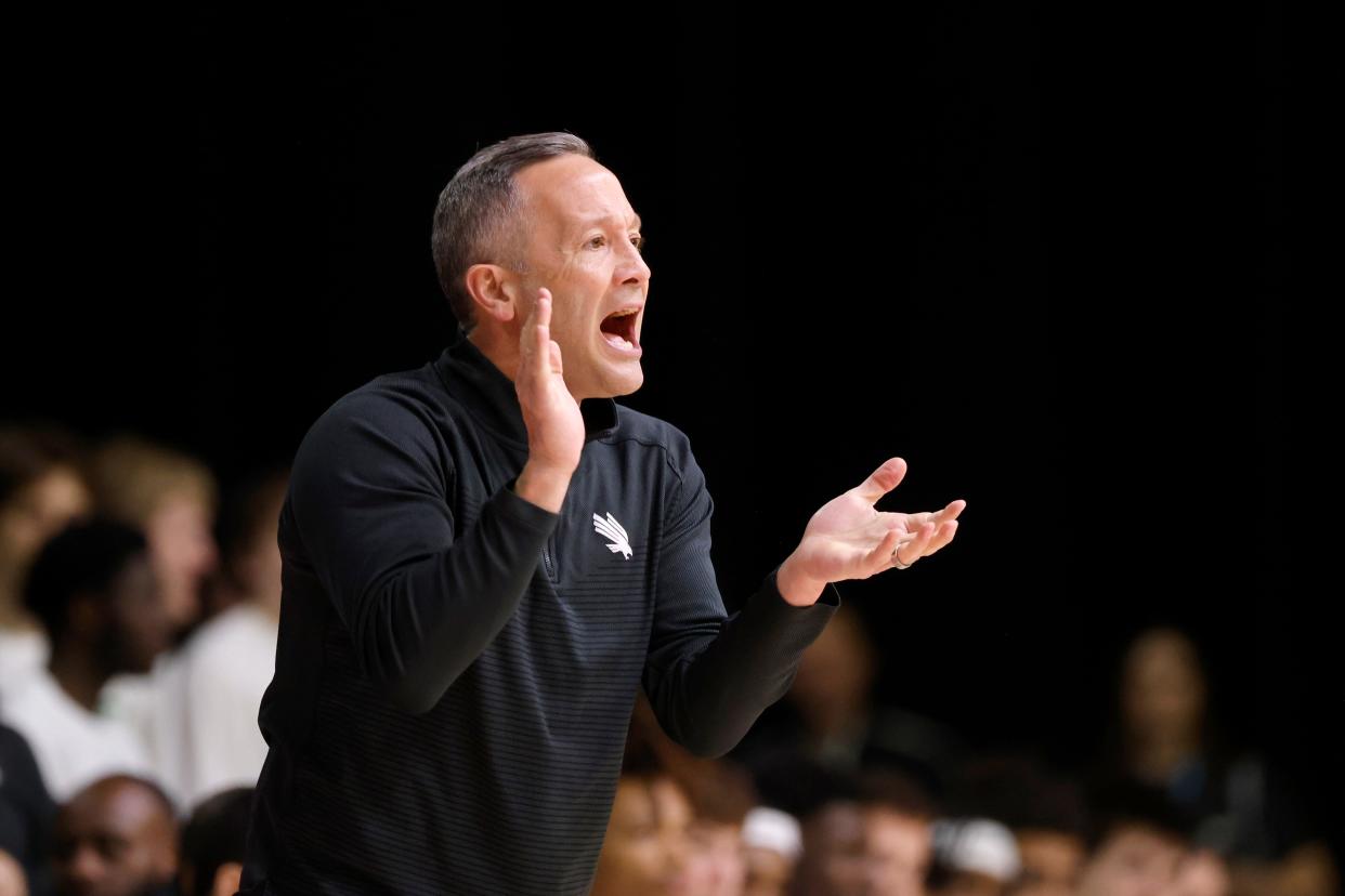 North Texas head coach Grant McCasland directs his team against UAB during the first half of a Conference USA men's semifinal NCAA college basketball game in Frisco, Texas, Friday, March 10, 2023. (AP Photo/Michael Ainsworth)