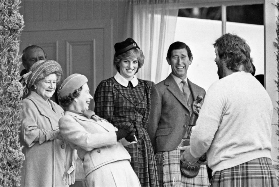 the royal family share a joke with geoff capes as they attend the braemar highland games in scotland