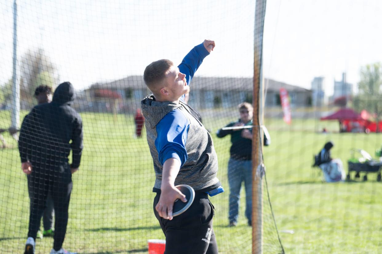 Harper Creek junior Ricky Johnson throws discus during the All-City Track and Field meet at Battle Creek Central High School on Friday, April 19, 2024.