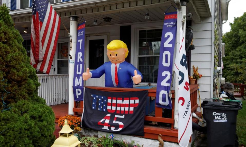 An inflatable figure of Donald Trump stands on a porch int he Northampton county borough of Stockertown.