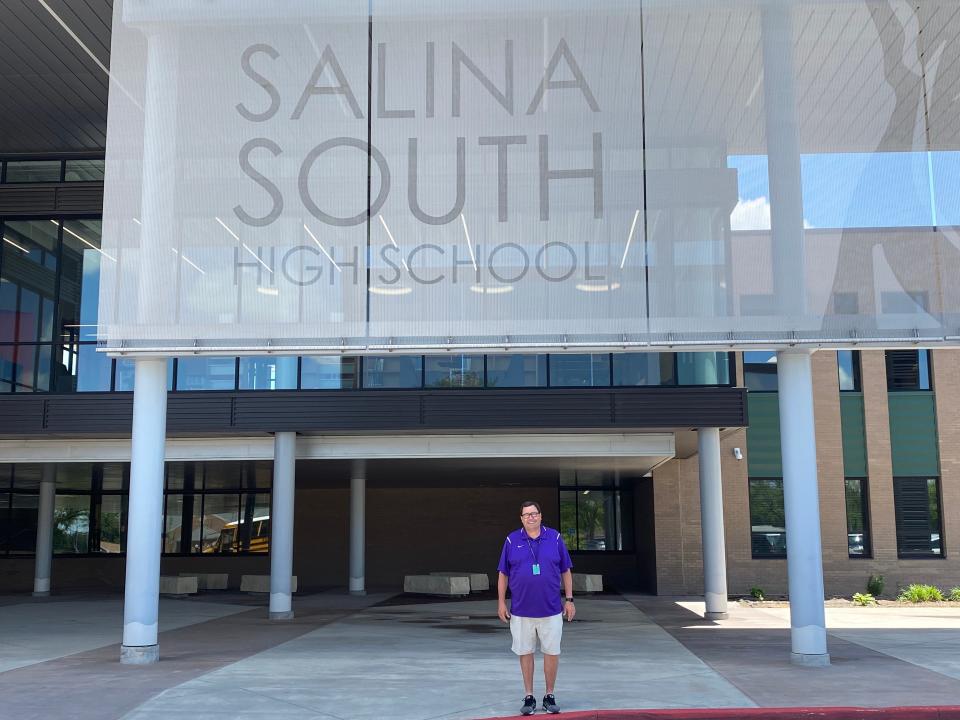 Salina South athletic director Ken Stonebraker stands in front of South High School Monday, June 6, 2022. Stonebraker has worked at South High since 1992 and announced his retirement in May.
