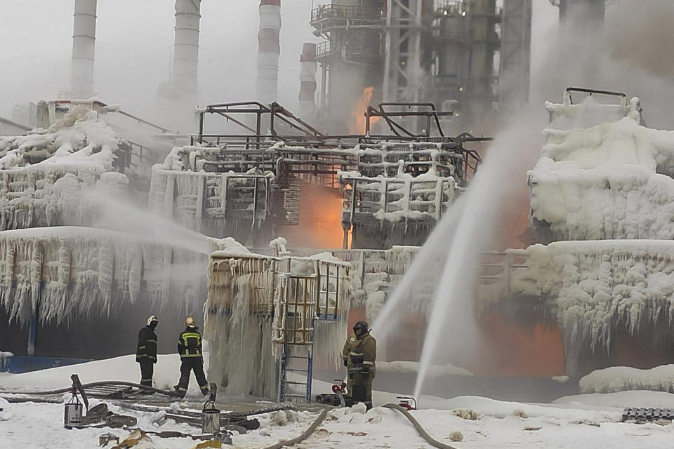 In this photo released by Telegram Channel of head of the Kingisepp district administration Yuri Zapalatskiy, fire fighters extinguish the blaze at Russia's second-largest natural gas producer, Novatek in Ust-Luga, 165 kilometers southwest of St. Petersburg, Russia, Sunday, Jan. 21, 2024. Fire broke out at a chemical transport terminal at Russia's Ust-Luga port Sunday following two explosions, regional officials reported. Local media reported that the port had been attacked by Ukrainian drones, causing a gas tank to explode. (Telegram Channel of head of the Kingisepp district administration Yuri Zapalatskiy via AP)