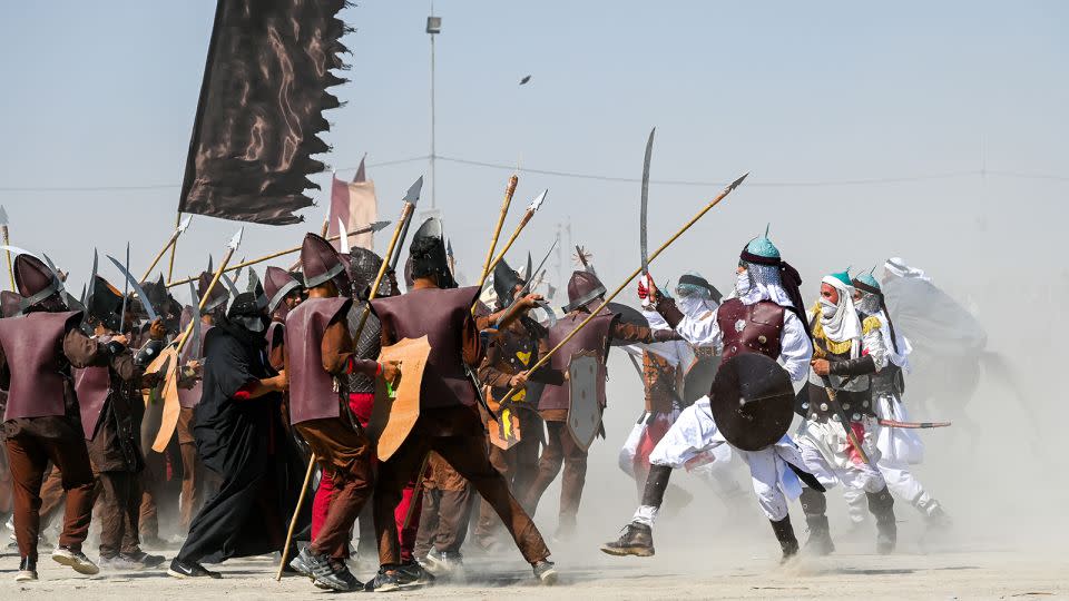 A reenactment of the seventh-century Battle of Karbala, in which Imam Hussein was martyred, is held to mark Ashura in Nasiriyah, Iraq. - Haidar Mohammed Ali/Anadolu/Getty Images