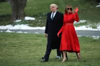 <p>Melania sported a custom-made red coat designed by Alice Roi with gloves and leather belt to match. She accessorized with her favorite Gucci sunglasses.</p>