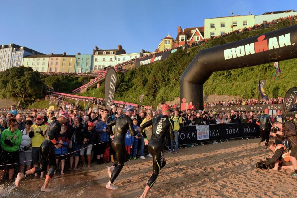 The Ironman Wales swim start at sunrise is one of the iconic moments of the event. <i>(Image: Gareth Davies Photography)</i>