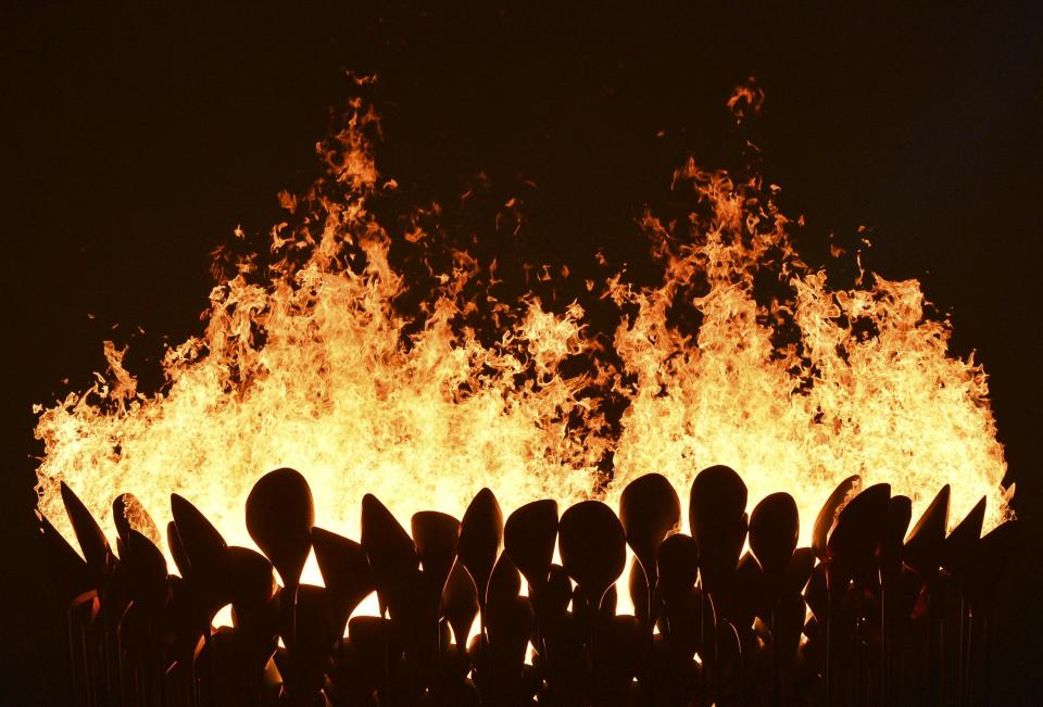 Flames leap from the cauldron during the opening ceremony of the London 2012 Olympic Games at the Olympic Stadium July 27, 2012. REUTERS/Toby Melville (BRITAIN - Tags: SPORT OLYMPICS TPX IMAGES OF THE DAY)