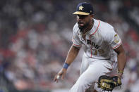 Houston Astros first baseman Jose Abreu fields a ground ball from Chicago White Sox's Yasmani Grandal, who was out at first during the sixth inning of a baseball game Thursday, March 30, 2023, in Houston. (AP Photo/Kevin M. Cox)