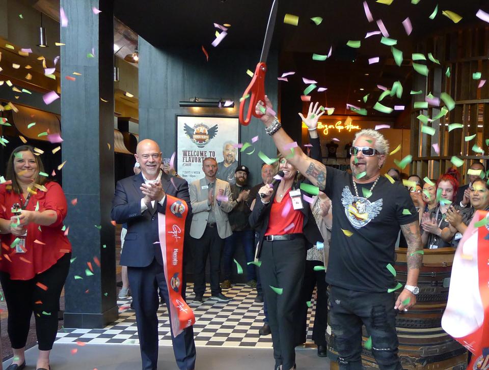 Guy Fieri helps Harrah's Council Bluffs celebrate the opening of his restaurant.