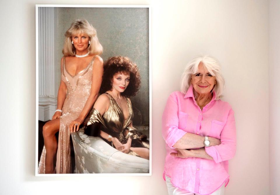 Nancy Ellison with images of Linda Evans and Joan Collins she took in 1985. The "Nancy Ellison: Icons Unveiled" exhibition at Sotheby's Palm Beach runs through Oct. 29.