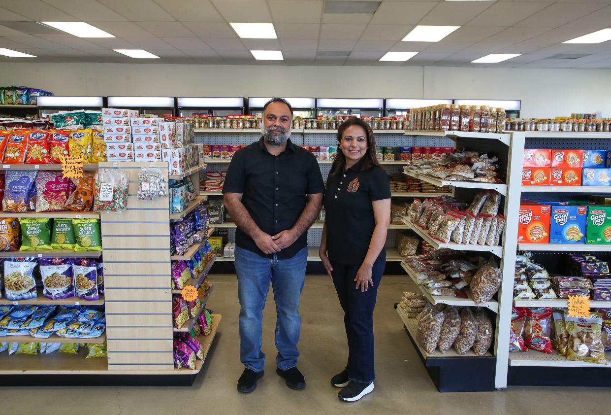 Sukhjot Singh, left, and Jyoti Kaur stand inside their new Indian grocery store, The Spice Rack, in Cathedral City.