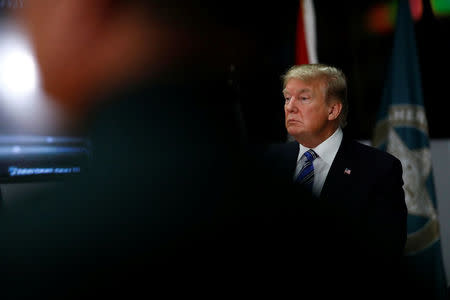 U.S. President Donald Trump meets with law enforcement at the Broward County Sheriff's Office in the wake of the shooting at Marjory Stoneman Douglas High School in Fort Lauderdale, Florida, U.S., February 16, 2018. REUTERS/Eric Thayer