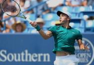 Aug 18, 2016; Mason, OH, USA; Borna Coric (CRO) returns a shot against Rafael Nadal (ESP) on day six during the Western and Southern tennis tournament at Linder Family Tennis Center. Mandatory Credit: Aaron Doster-USA TODAY Sports