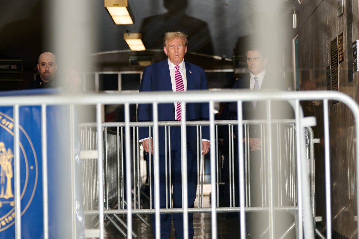 Donald Trump speaks to reporters inside a Manhattan criminal courthouse on 19 April. (via REUTERS)