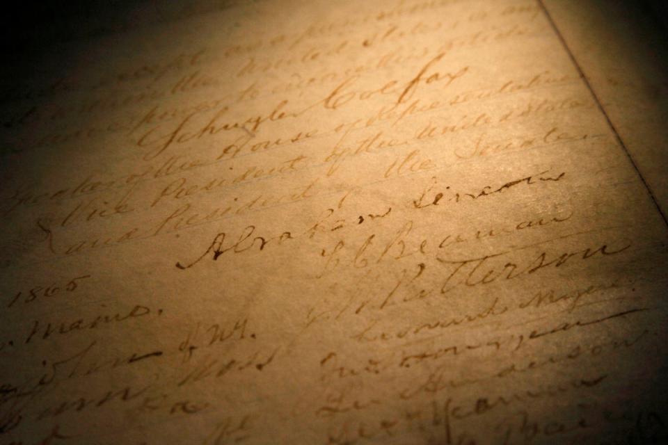 The name of President Abraham Lincoln is seen on a rare, restored copy of the 13th Amendment that ended slavery (AP)