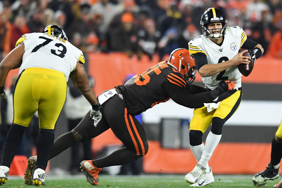 CLEVELAND, OH - NOVEMBER 14, 2019: Quarterback Mason Rudolph #2 of the Pittsburgh Steelers is hit by defensive tackle Larry Ogunjobi #65 of the Cleveland Browns in the second quarter of a game on November 14, 2019 at FirstEnergy Stadium in Cleveland, Ohio. Cleveland won 21-7. (Photo by: 2019 Nick Cammett/Diamond Images via Getty Images)