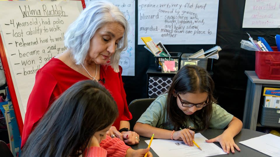 In this photo provided by the Tennessee Department of Education, 2nd grade teacher Missy Testerman, center, who teaches English as a second language, works with students Dafne Lozano, left, and Dwiti Patel, right, at the Rogersville City School on Thursday, March 13, in Rogersville, Tennessee. - Tennessee Department of Education/AP