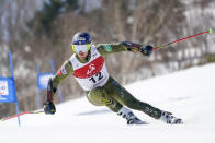 Ted Ligety of the United States competes in the men's giant slalom during the FIS Alpine Ski World Cup at Naeba Ski Resort in Yuzawa, Niigata prefecture, northern Japan, Saturday, Feb. 22, 2020. (AP Photo/Christopher Jue)