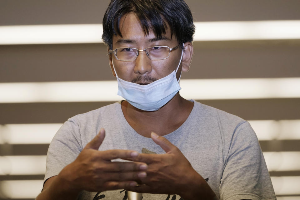 Japanese freelance journalist Yuki Kitazumi speaks upon arrival at Narita international airport, after returning home from a Myanmar prison, in Narita, east of Tokyo, on May 14, 2021. Kitazumi said Friday, May 21, 2021 during an online press conference that military and police interrogators repeatedly asked him about his friends, clients and fake allegations. And he heard from other inmates about their horrifying prison abuses, including repeated beatings during nonstop, dayslong interrogations. (AP Photo/Eugene Hoshiko)