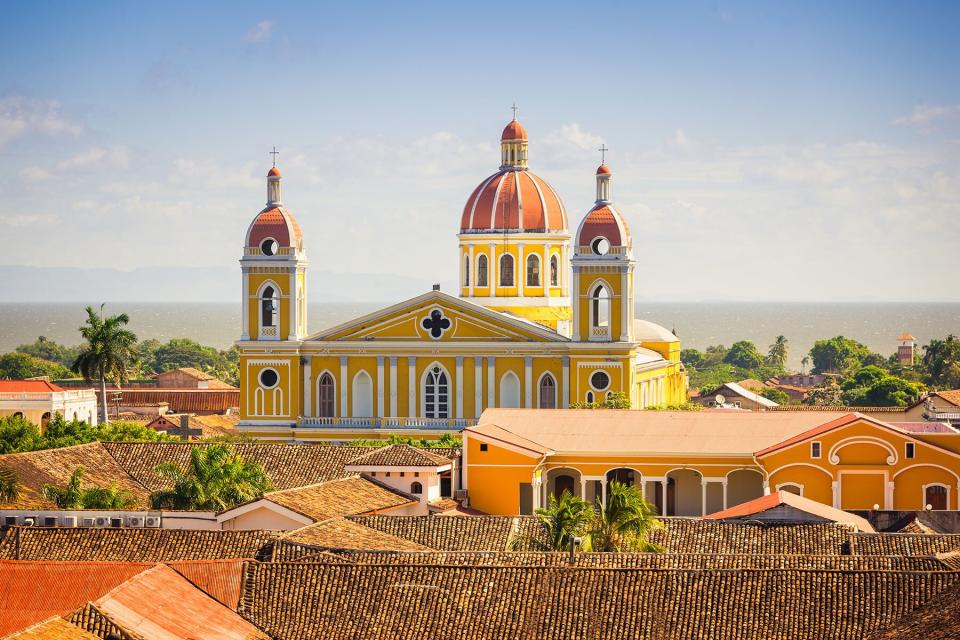 View towards the Cathedral of Granada, the famous Icon of the City of Grenada from above under a blue summer sky