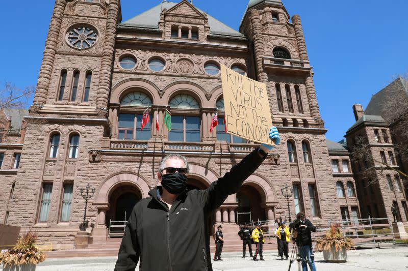 Protesters demand the removal of the provincial coronavirus disease restrictions in Toronto