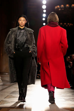 Models present creations by designer Kris Van Assche as part of his Fall/Winter 2019-2020 collection show for fashion house Berluti during Men's Fashion Week in Paris, France, January 18, 2019. REUTERS/Gonzalo Fuentes