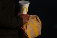 A man carries branded McDonald's purchases in London, Britain December 9, 2016. REUTERS/Neil Hall