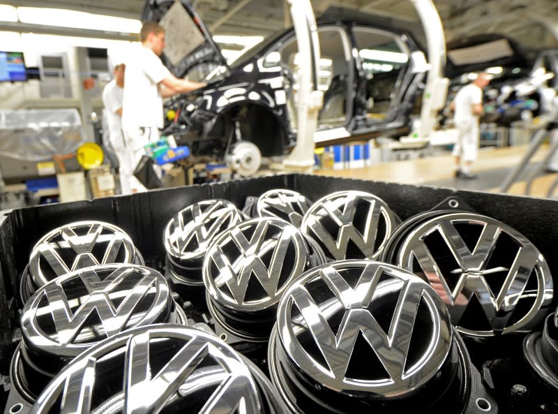 Emblems of VW Golf VII car are pictured in a production line at the plant of German carmaker Volkswagen in Wolfsburg, February 25, 2013. REUTERS/Fabian Bimmer/File Photo