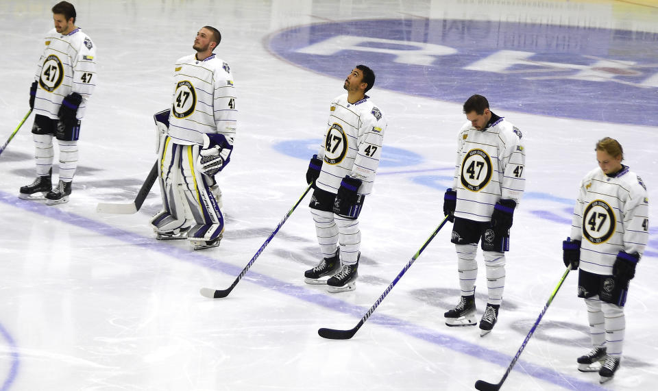 Nottingham Panthers players wearing number 47, Adam Johnson's number, pay tribute before the Ice Hockey Adam Johnson memorial game between Nottingham Panthers and Manchester Storm at the Motorpoint Arena, Nottingham, England, Saturday, Nov. 18, 2023. The memorial game is held three weeks after Adam Johnson, 29, suffered a fatal cut to his neck during a game against Sheffield Steelers on Saturday, October 28. (AP Photo/Rui Vieira)