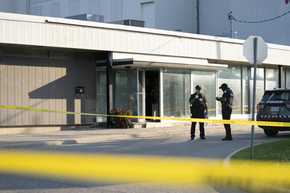 Toronto police officers investigate reports of gunshots, in Toronto, Monday, June 17, 2024. (Arlyn McAdorey/The Canadian Press via AP)